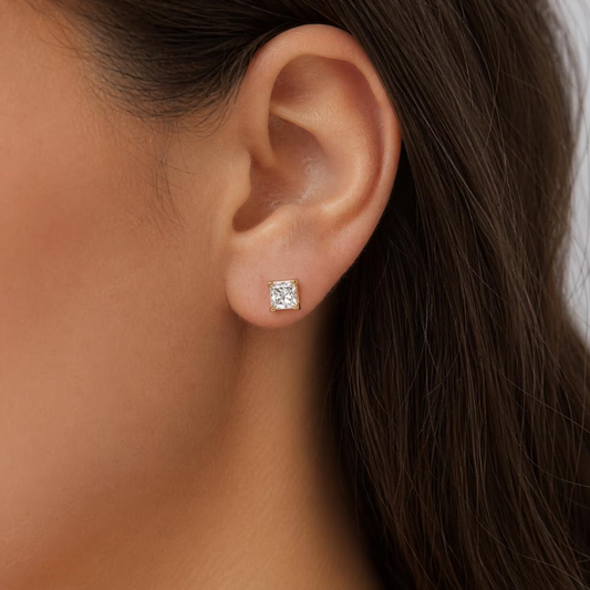 yellow gold diamond stud earrings on model
