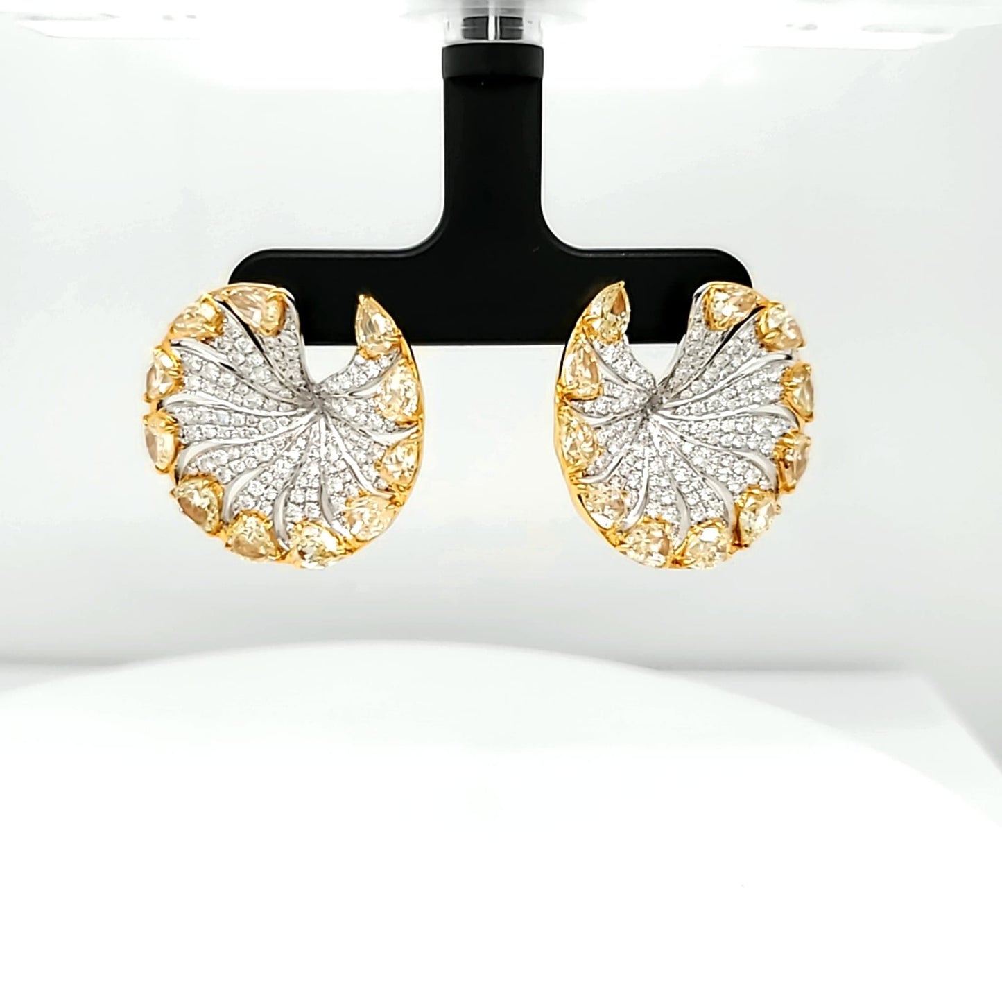 Natural Diamond Round and Fancy Yellow Pear Shaped Diamonds, in Yellow Gold