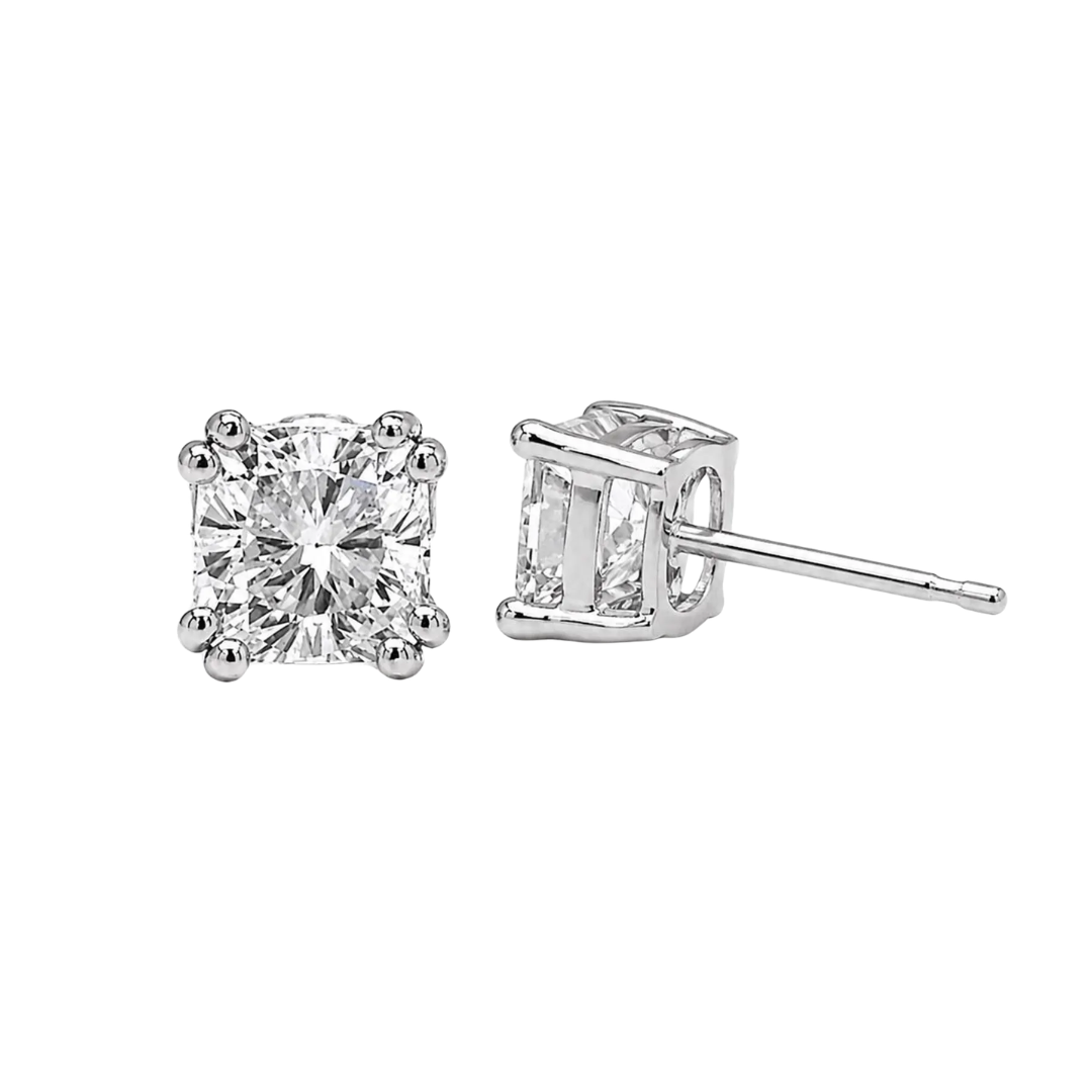 Two diamond stud earrings on a white background