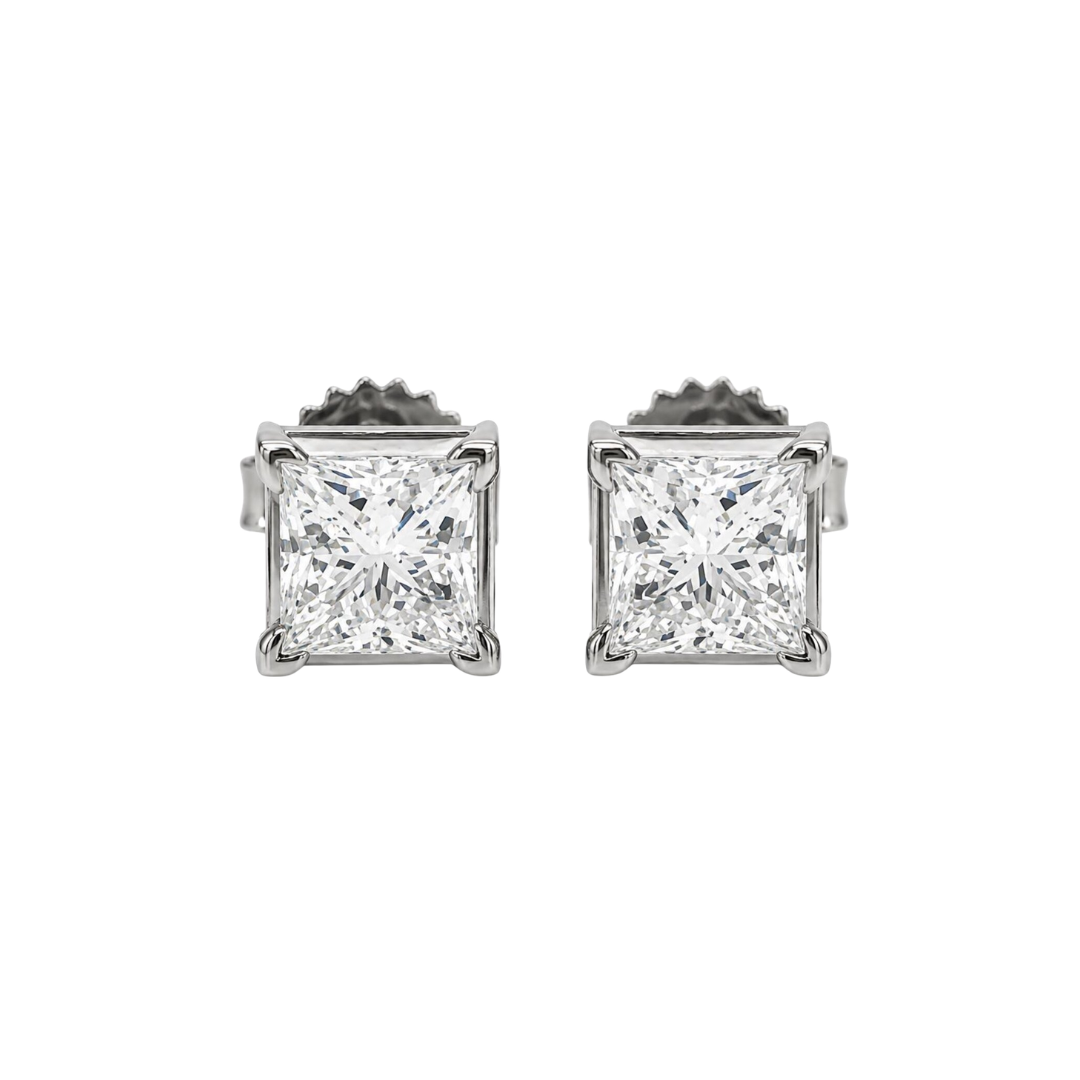 Pair of diamond stud earrings on a white background