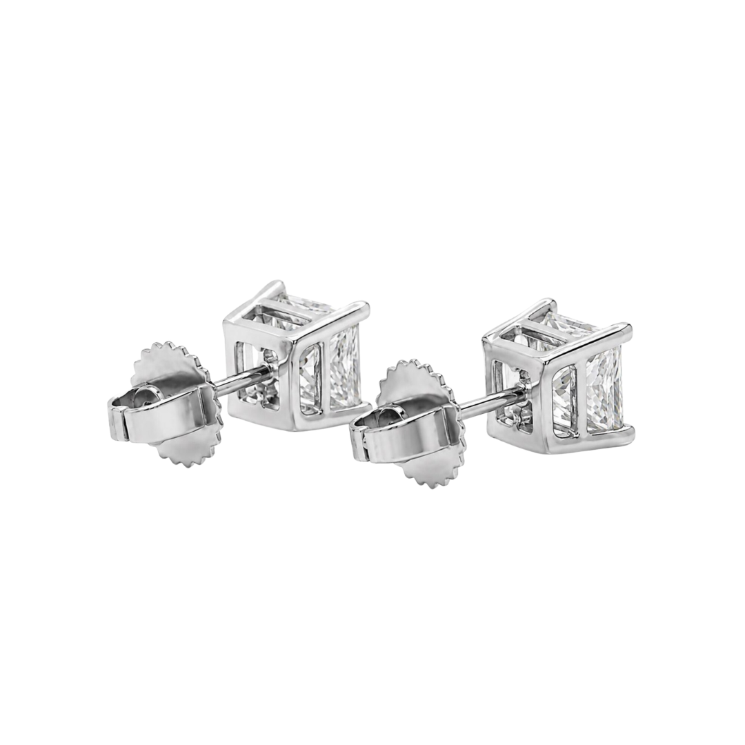 Pair of diamond stud earrings on a white background back