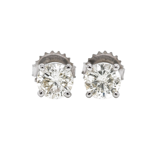Pair of diamond stud earrings on a white background