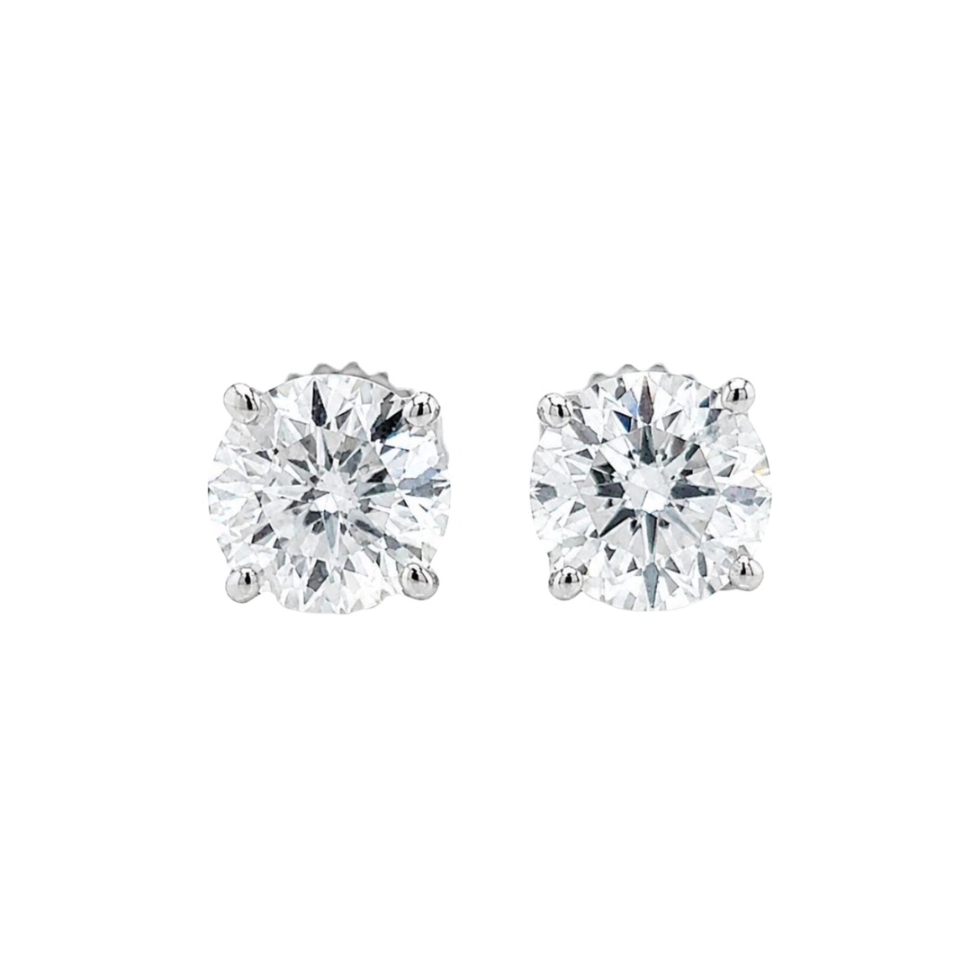 Pair of diamond stud earrings on a white background front