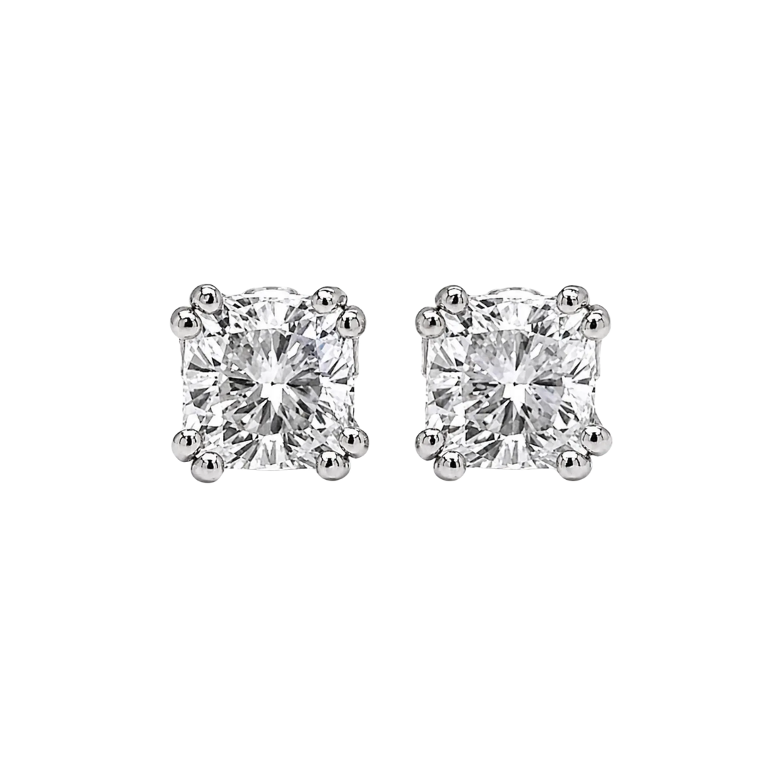 Pair of diamond stud earrings on a white background
