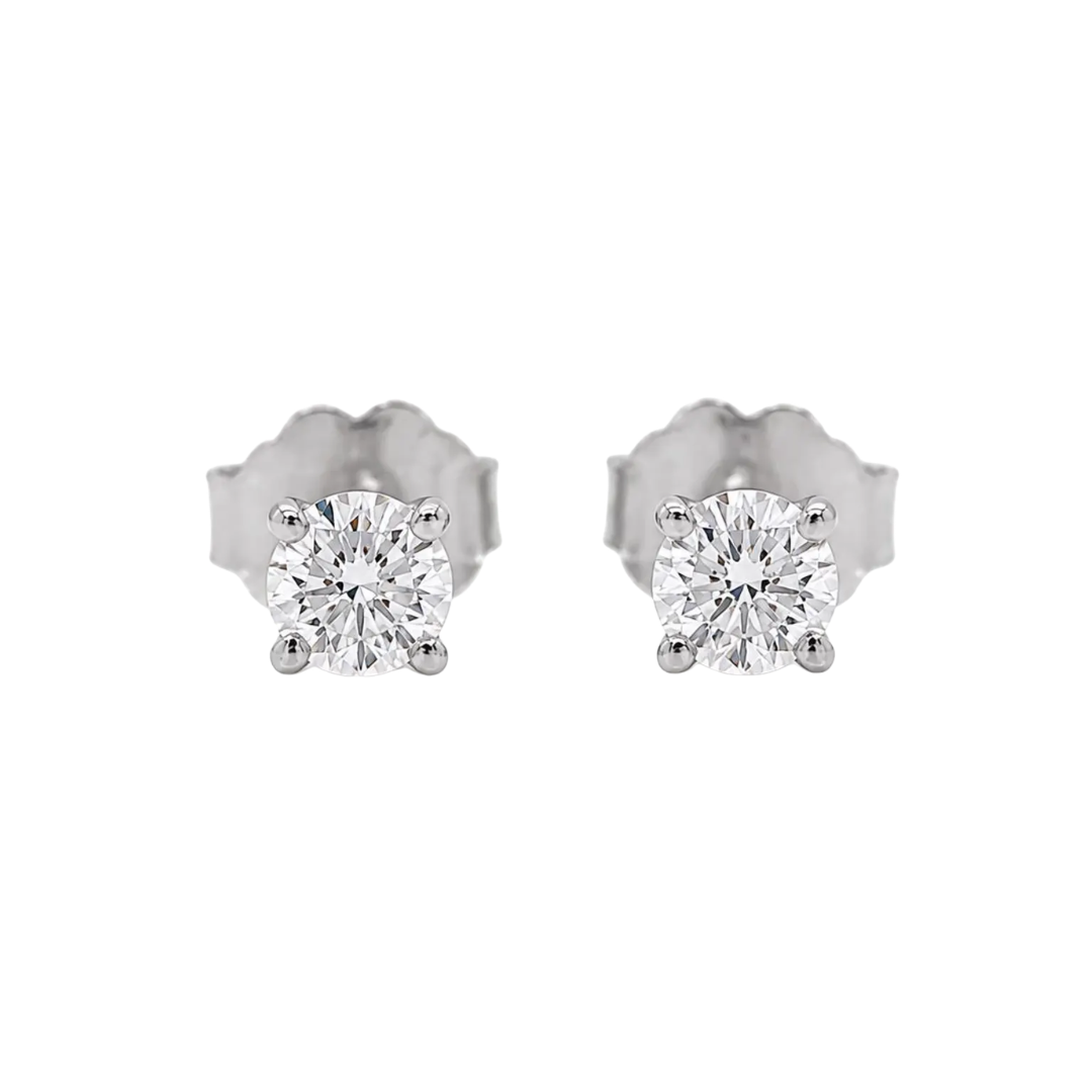 Pair of diamond stud earrings on a white background