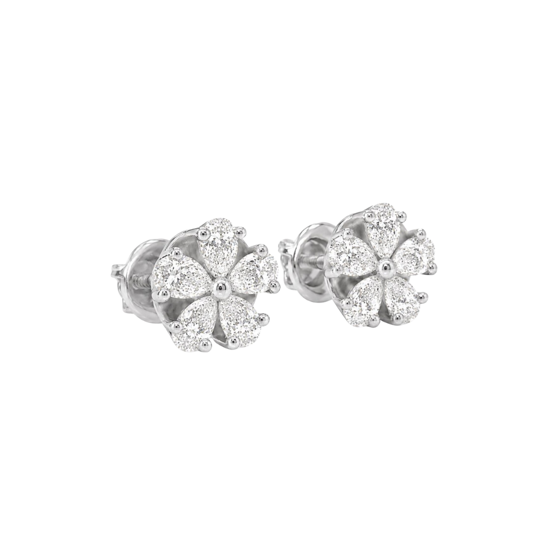 Pair of silver flower-shaped earrings on a white background