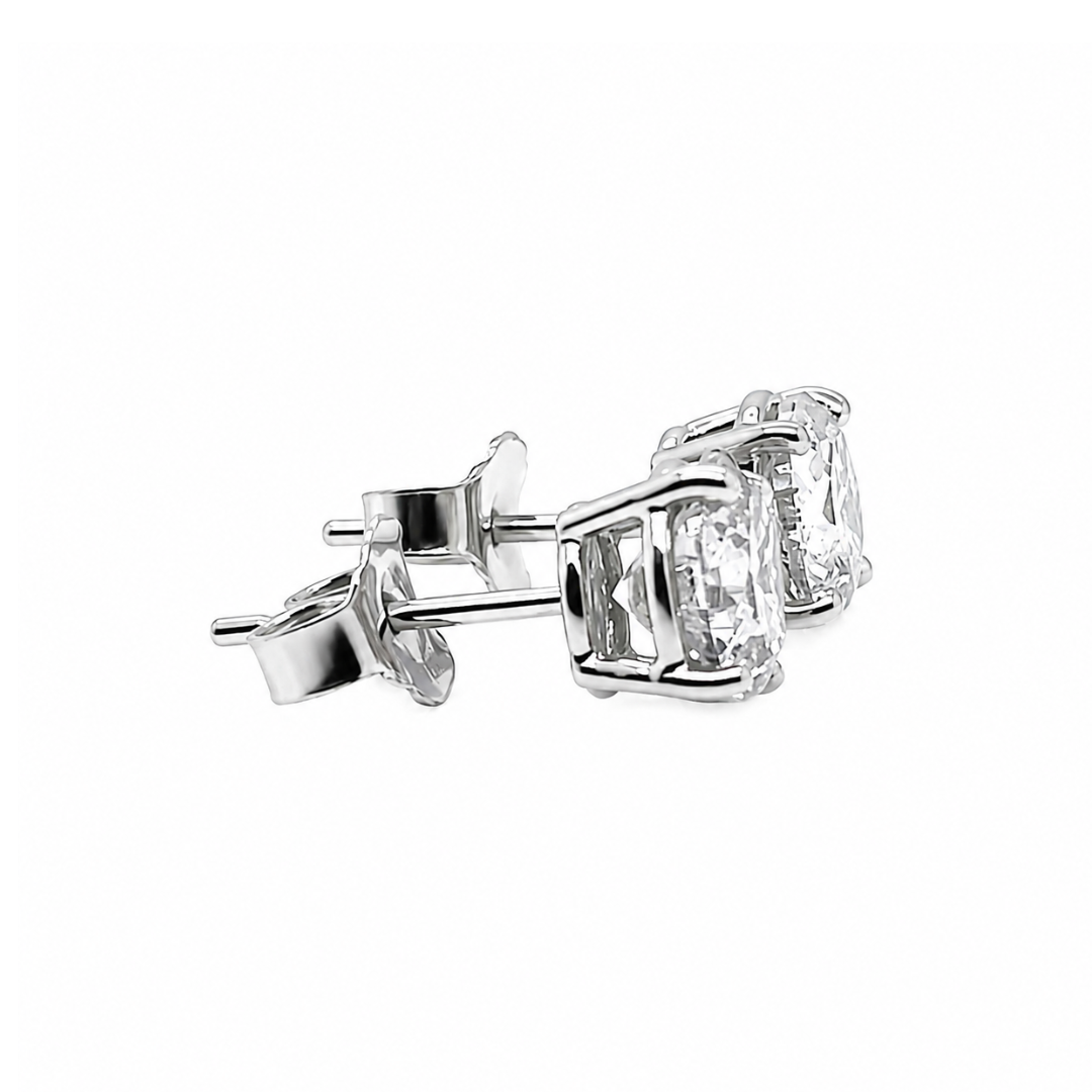 Diamond stud earrings on a white background side