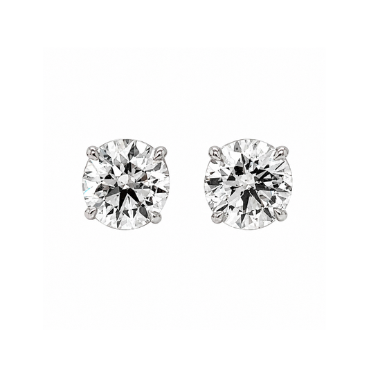 Pair of diamond stud earrings on a white background