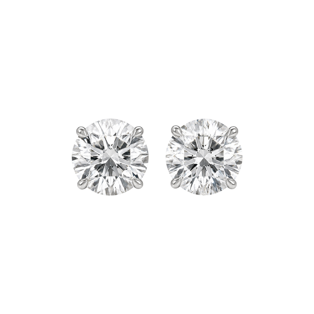 Pair of diamond stud earrings on a white background