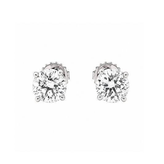 Pair of diamond stud earrings on a white background