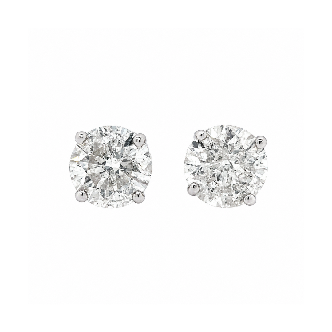 Pair of diamond stud earrings on a white background