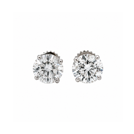 Pair of diamond stud earrings on a white background